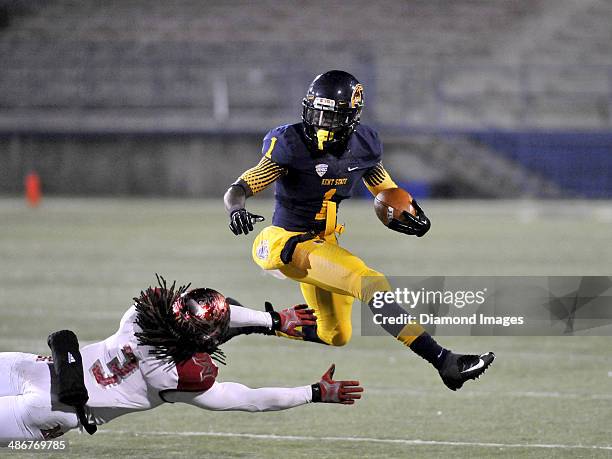 Wide receiver Dri Archer of the Kent State Golden Flashes leaps over a defender during a game against the Miami Redhawks on November 13, 2013 at Dix...