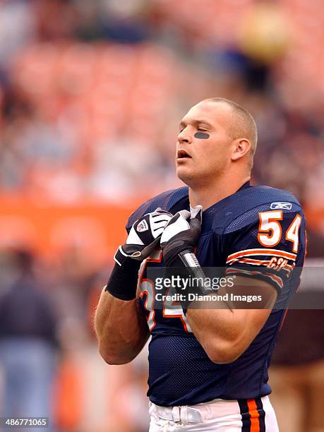 Linebacker Brian Urlacher of the Chicago Bears pauses for a moment during warm ups prior to a game against the Cleveland Browns on October 9, 2005 at...