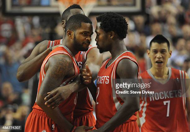 Troy Daniels of the Houston Rockets is mobbed by teammates James Harden and Patrick Beverley after hitting what ended up to be the game winning shot...