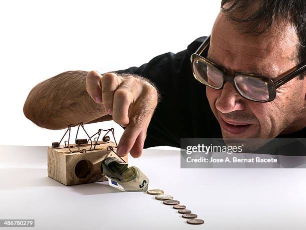 Adult Man Dodging A Trap To Catch Money, ストックフォト