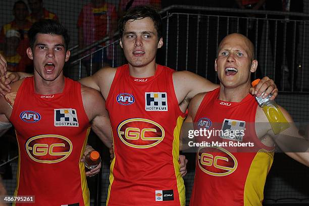 Suns players Jaeger O'Meara, Kade Kolodjashnij and Gary Ablett celebrate victory after the round six AFL match between the Gold Coast Suns and the...