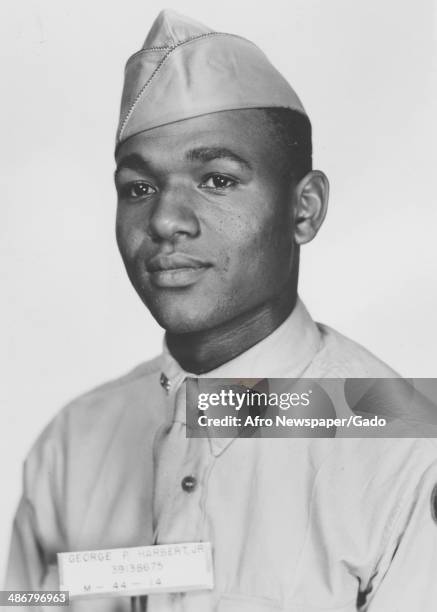 George Harbert Jr head and shoulders portrait, taken during his service in World War 2 as part of the Tuskegee Airmen, the first squadron of African...