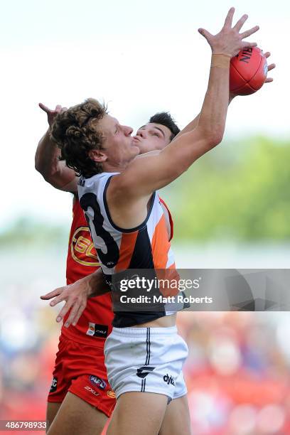 Will Hoskin-Elliott of the Giants marks the ball over Jaeger O'Meara of the Suns during the round six AFL match between the Gold Coast Suns and the...