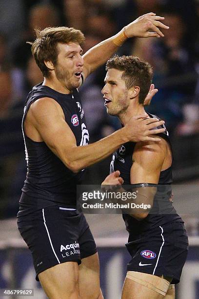 Dale Thomas and Marc Murphy of the Blues celebrate a goal during the round six AFL match between the Carlton Blues and the West Coast Eagles at...