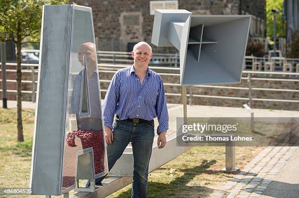 The Berlin artist Matthias Deumlich pictured with his artwork 'Teilchenbeschleuniger' on April 25, 2014 in Bingen, Germany. The 'Sculpture Triennial...