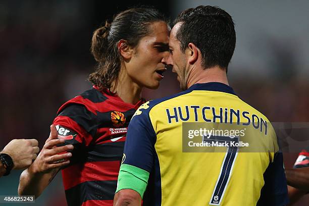 Jerome Polenz of the Wanderers and John Hutchinson of the Mariners exchange heated words during the A-League Semi Final match between the Western...