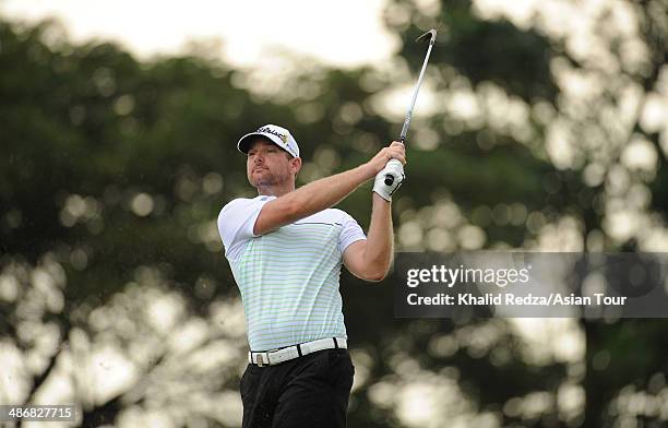 Marcus Both of Australia plays a shot during round three of the CIMB Niaga Indonesian Masters at Royale Jakarta Golf Club on April 26, 2014 in...