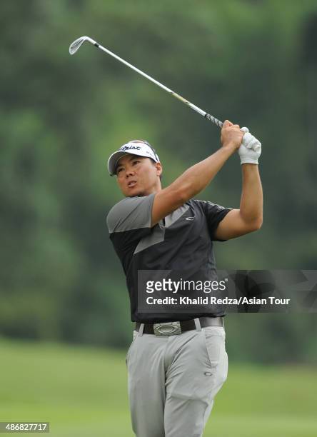 Lam Chih Bing of Singapore plays a shot during round three of the CIMB Niaga Indonesian Masters at Royale Jakarta Golf Club on April 26, 2014 in...