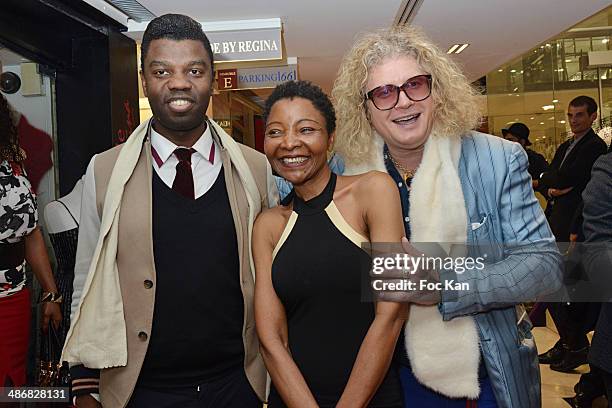 Jean Barthelemy Bokassa, Regina Martin Djimbissi and Pierre Jean Chalencon attend 'La Mode By Regina' Cocktail At the Regina's Shop Champs Elysee on...