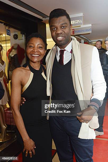 Jean Barthelemy Bokassa and fashion designer Regina Martin Djimbissi attend 'La Mode By Regina' Cocktail At the Regina's Shop Champs Elysee on April...