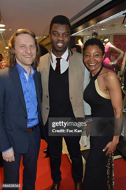 Xavier Martin, Jean Barthelemy Bokassa and Regina Martin Djimbissi attend 'La Mode By Regina' Cocktail At the Regina's Shop Champs Elysee on April...