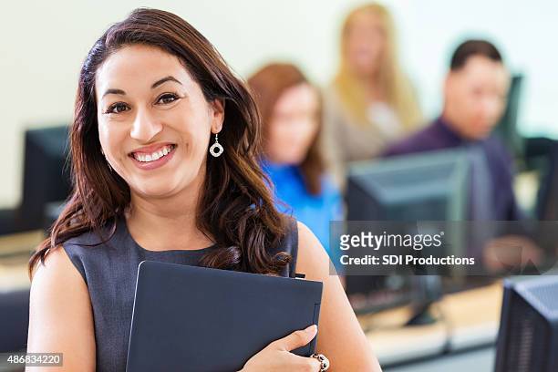 young hispanic businesswoman taking job training computer course - adult student stock pictures, royalty-free photos & images