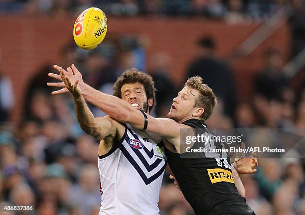 Zac Clarke of the Dockers competes with Tom Jonas of the Power during the 2015 AFL round 23 match between Port Adelaide Power and the Fremantle...