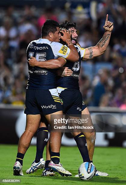 James Tamou of the Cowboys celebrates after scoring a try during the round 26 NRL match between the North Queensland Cowboys and the Gold Coast...