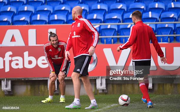 Wales player Gareth Bale shares a joke with team mates James Collins and Aaron Ramsey during Wales training ahead of their UEFA European Championship...