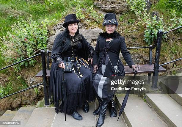 Goths take a seat during the Goth weekend on April 26, 2014 in Whitby, England. The Whitby Goth weekend began in 1994 and happens twice each year....