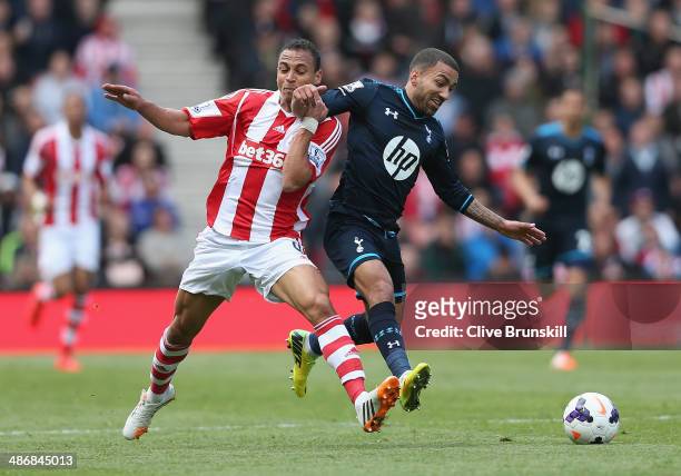 Peter Odemwingie of Stoke City in action with Aaron Lennon of Tottenham Hotspur during the Barclays Premier League match between Stoke City and...