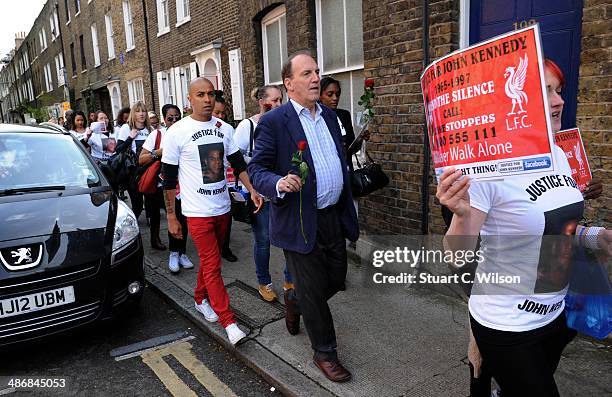 Singer Jade Jones and Simon Hughes MP march through East London with famly and supporters on April 26, 2014 in London, England. They are marching to...