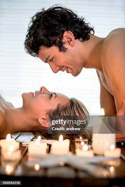 romantic couple at the spa - massage couple stock pictures, royalty-free photos & images