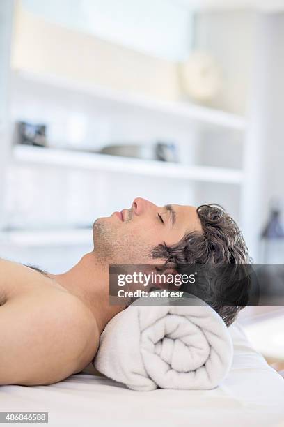 man relaxing at the spa - men facial stock pictures, royalty-free photos & images