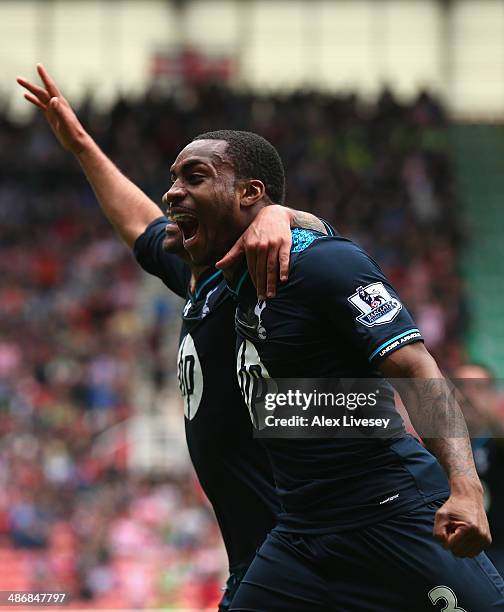 Danny Rose of Tottenham Hotspur celebrates with Aaron Lennon after scoring the opening goal during the Barclays Premier League match between Stoke...