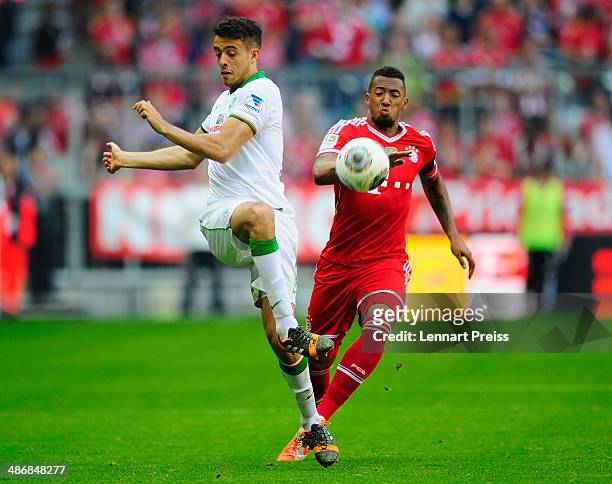 Jerome Boateng of Muenchen challenges Franco Di Santo of Bremen during the Bundesliga match between FC Bayern Muenchen and Werder Bremen at Allianz...