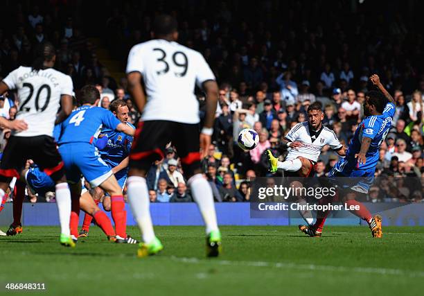 Ashkan Dejagah of Fulham scores their first goal during the Barclays Premier League match bewteen Fulham and Hull City at Craven Cottage on April 26,...
