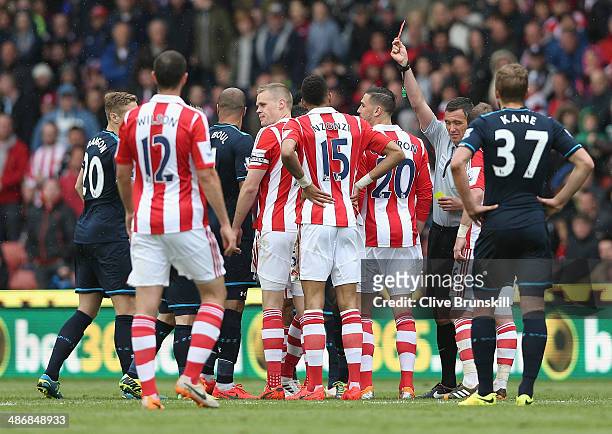 Ryan Shawcross of Stoke City is shown the red card by referee Andre Marriner during the Barclays Premier League match between Stoke City and...