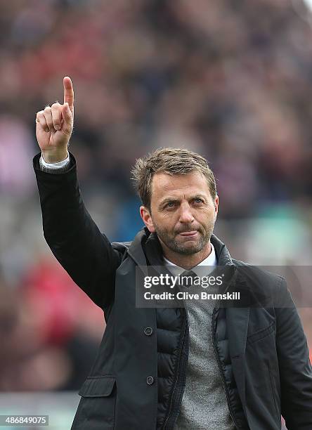 Tottenham Hotspur manager Tim Sherwood celebrates his teams victory to his supporters during the Barclays Premier League match between Stoke City and...