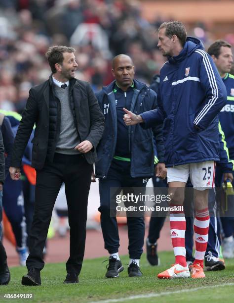 Tottenham Hotspur manager Tim Sherwood shares a joke with Peter Crouch of Stoke City during the Barclays Premier League match between Stoke City and...