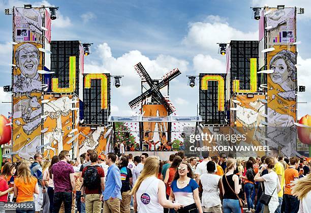 Dutch revellers take part in the festivities at the Olympic Stadium in Amsterdam, The Netherlands, on April 26 on occasion of the first King's Day ,...