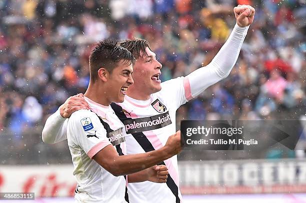 Paulo Dybala of Palermo celebrates with Andrea Belotti after scoring the opening goal during the Serie B match between US Latina Calcio and US Citta...