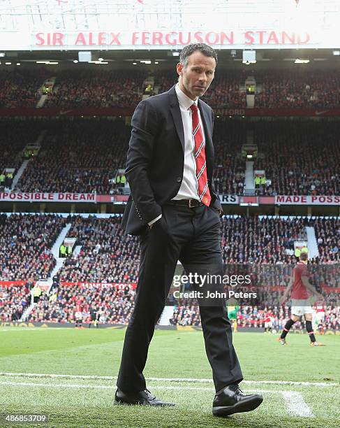 Interim Manager Ryan Giggs of Manchester United watches from the touchline during the Barclays Premier League match between Manchester United and...