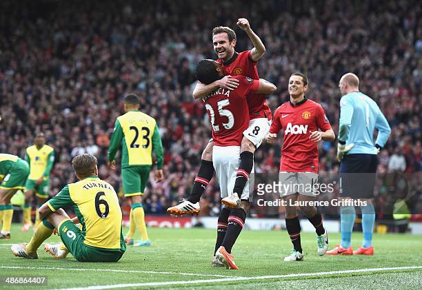 Juan Mata of Manchester United celebrates scoring the fourth goal during the Barclays Premier League match between Manchester United and Norwich City...