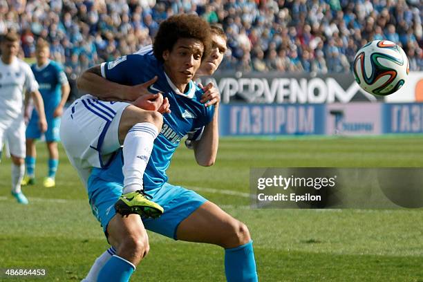 Axel Witsel of FC Zenit St. Petersburg and Nikita Chicherin of FC Volga Nizhny Novgorod vie for the ball during the Russian Football League...