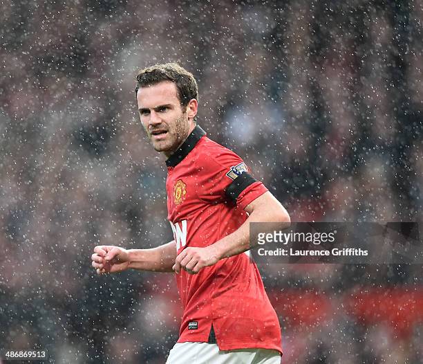 Juan Mata of Manchester United in a rain during the Barclays Premier League match between Manchester United and Norwich City at Old Trafford on April...
