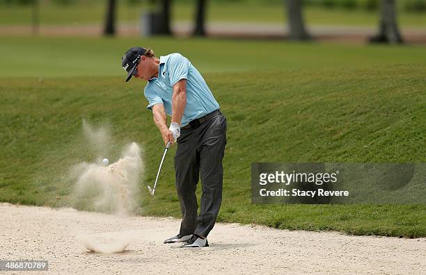 Charley Hoffman chips out of the bunker on the 9th during Round Three of the Zurich Classic of New Orleans at TPC Louisiana on April 26, 2014 in...