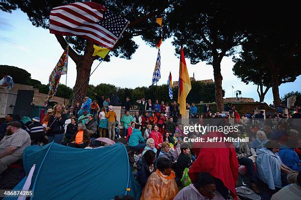 Pilgrims prepare to spend the evening waiting to enter Saint Peter's Square tomorrow morning on April 26, 2014 in Vatican City, Vatican. Dignitaries,...