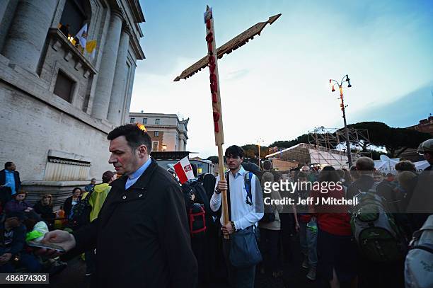 Pilgrims prepare to spend the evening waiting to enter Saint Peter's Square tomorrow morning on April 26, 2014 in Vatican City, Vatican. Dignitaries,...