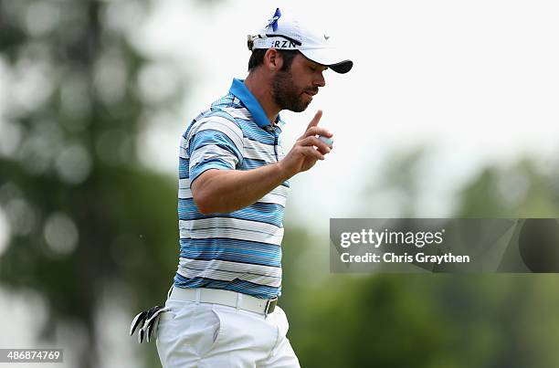 Paul Casey waves to the crowd after his putt on the 18th during Round Three of the Zurich Classic of New Orleans at TPC Louisiana on April 26, 2014...