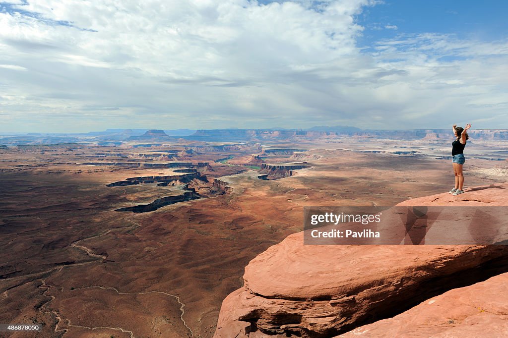 Young Woman,Hands raised, Enjoying View of Grand Canyon USA