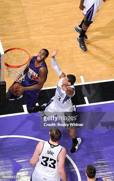 Dionte Christmas of the Phoenix Suns shoots against Ray McCallum of the Sacramento Kings on April16, 2014 at Sleep Train Arena in Sacramento,...