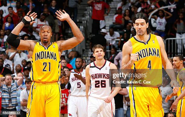 David West and Luis Scola of the Indiana Pacers react after a turnover by the Atlanta Hawks in Game Four of the Eastern Conference Quarterfinals...