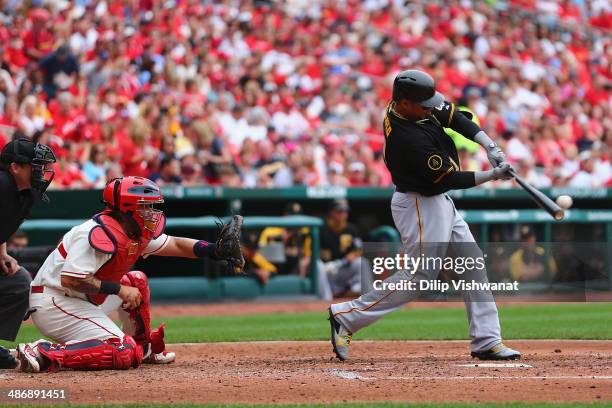 Jose Tabata of the Pittsburgh Pirates hits an RBI single in the fourth inning against the St. Louis Cardinals at Busch Stadium on April 26, 2014 in...