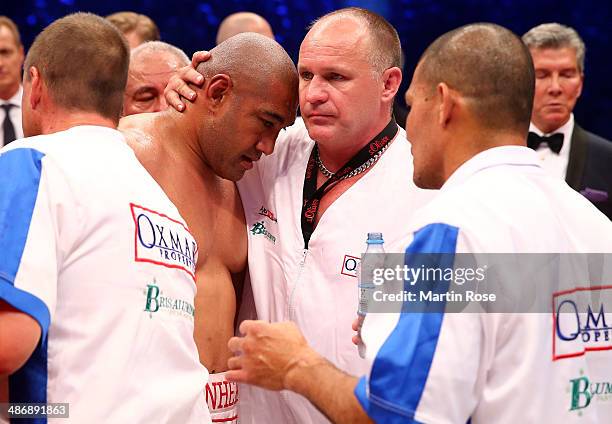 Alex Leapai of Australia looks dejected after losing the WBO, WBA, IBF and IBO heavy weight title fight between Wladimir Klitschkoat and Alex Lepai...