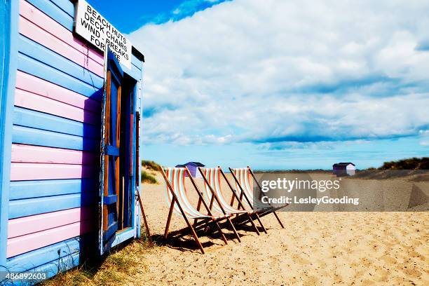 english seaside beach hut and deck chairs - yarmouth isla de wight fotografías e imágenes de stock