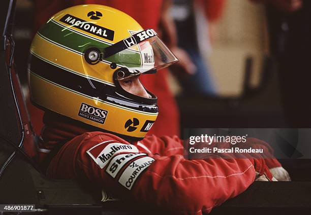 Ayrton Senna of Brazil sits aboard the Honda Marlboro McLaren McLaren MP4/5 Honda V10 before the Fuji Television Japanese Grand Prix on 22nd October...