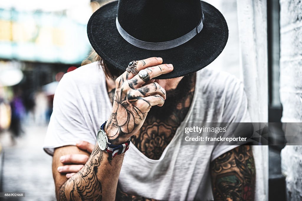 Hipster portrait with tattoo