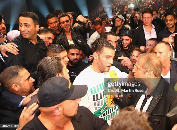 Former heavy weight fighter Manuel Charr screams to Wladimri Klitschko after the WBO, WBA, IBF and IBO heavy weight title fight between Wladimir...