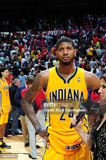 Paul George of the Indiana Pacers gets interviewed after the game against the Atlanta Hawks during Game Four of the Eastern Conference Quarterfinals...